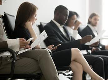 Prospective employees waiting in waiting room